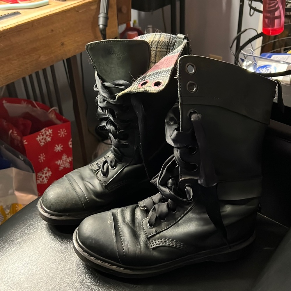 Dark green DrMarten combat boots.